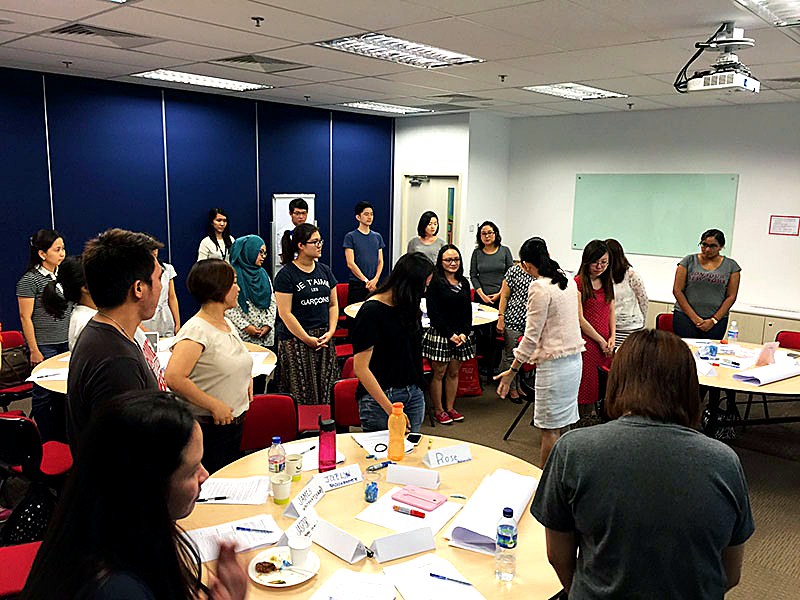 Sally Tang leading a Body Language and nonverbal intelligence group training exercise
